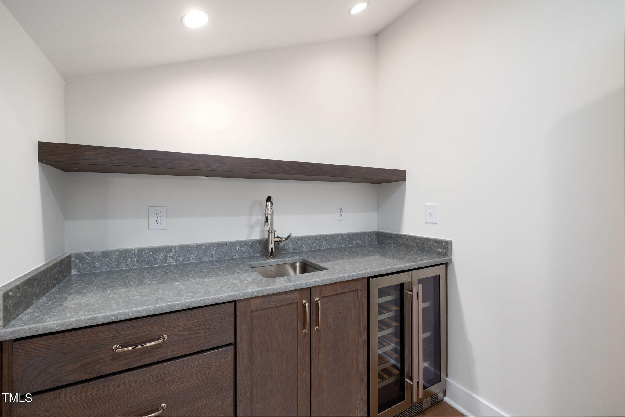 1212 Gunnison Place Raleigh, NC 27609 - Photo 42 of 53 a kitchen with a sink and cabinets