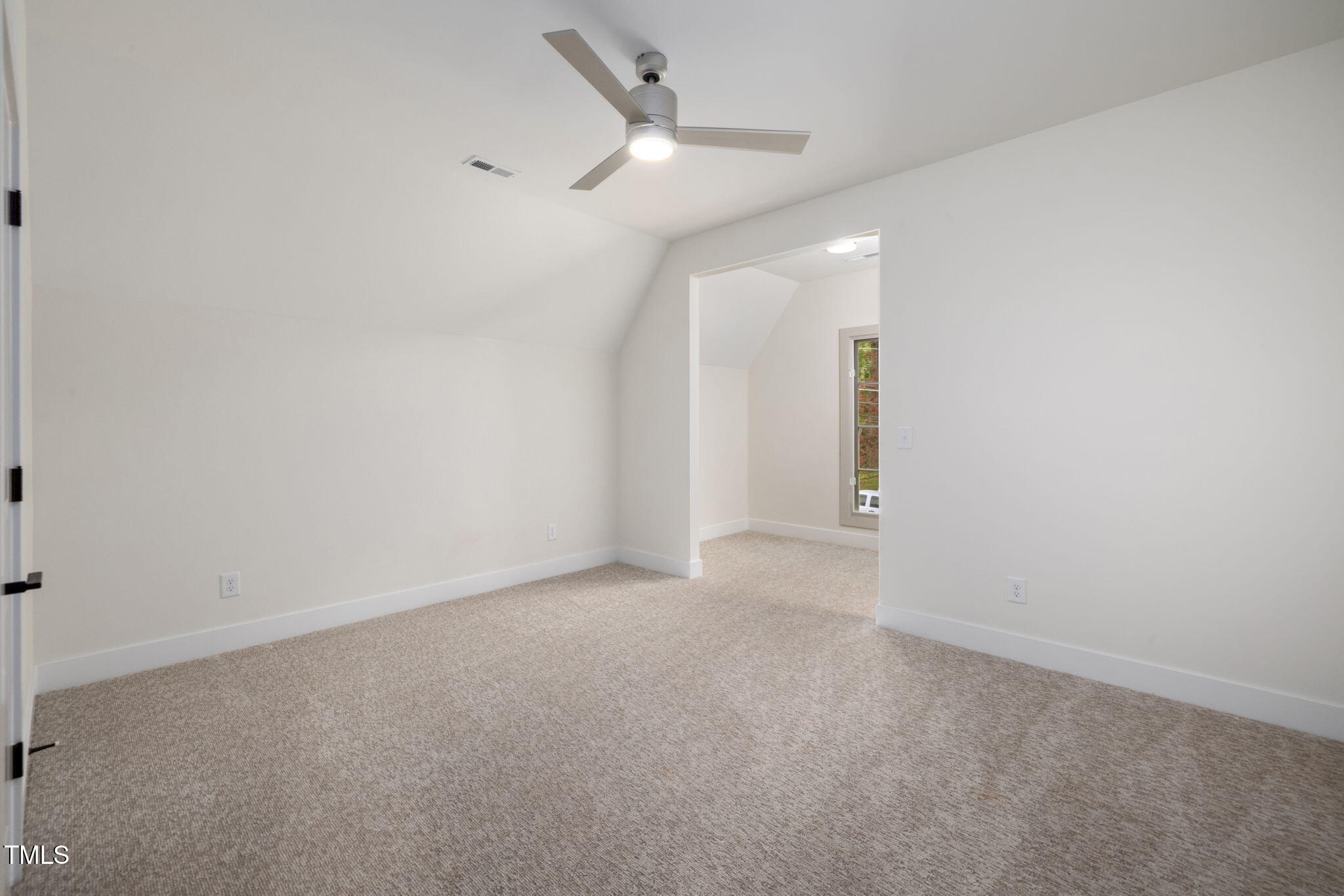 1212 Gunnison Place Raleigh, NC 27609 - Photo 44 of 53 an empty room with a ceiling fan and a fan