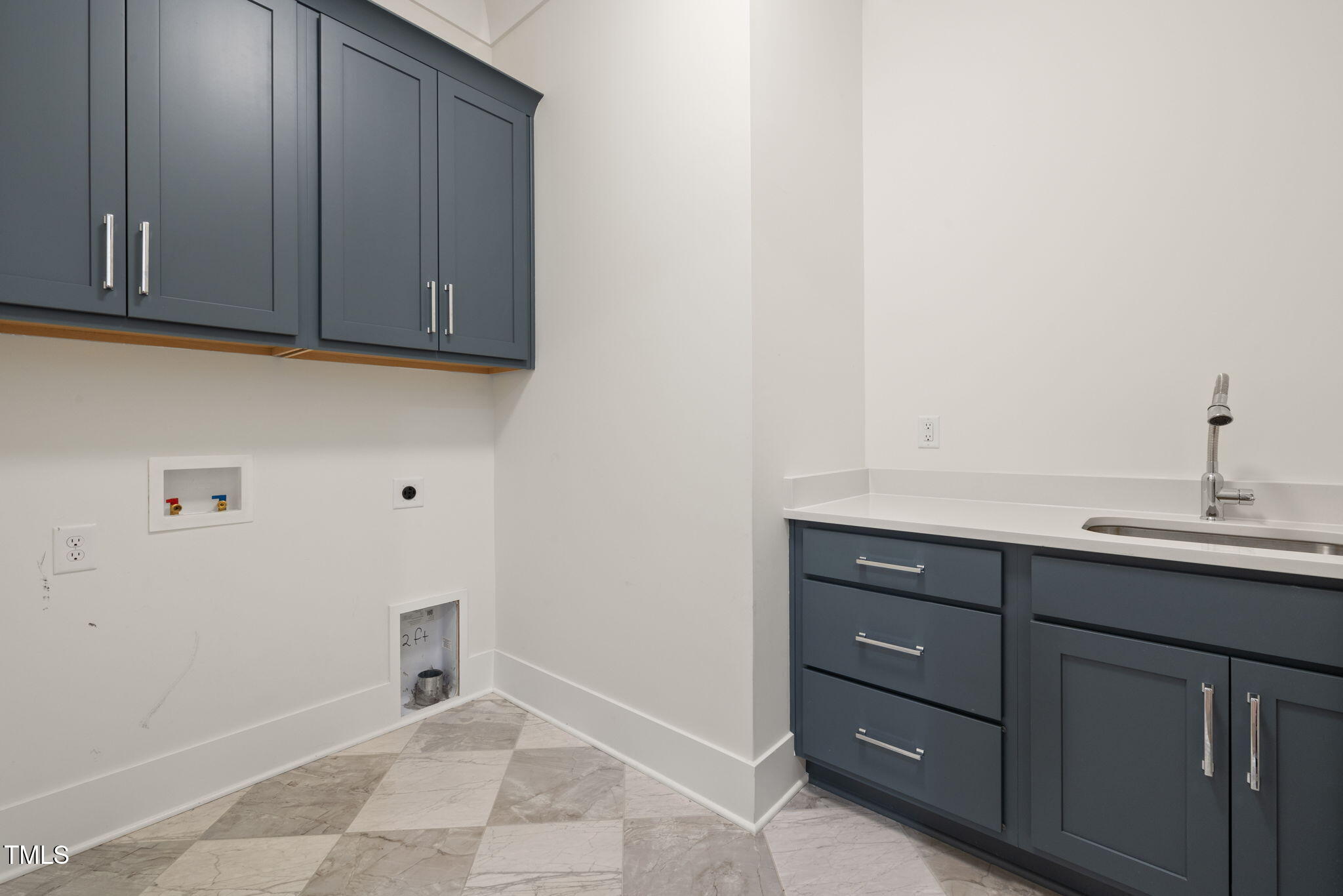 1212 Gunnison Place Raleigh, NC 27609 - Photo 46 of 53 a bathroom with a sink and cabinets