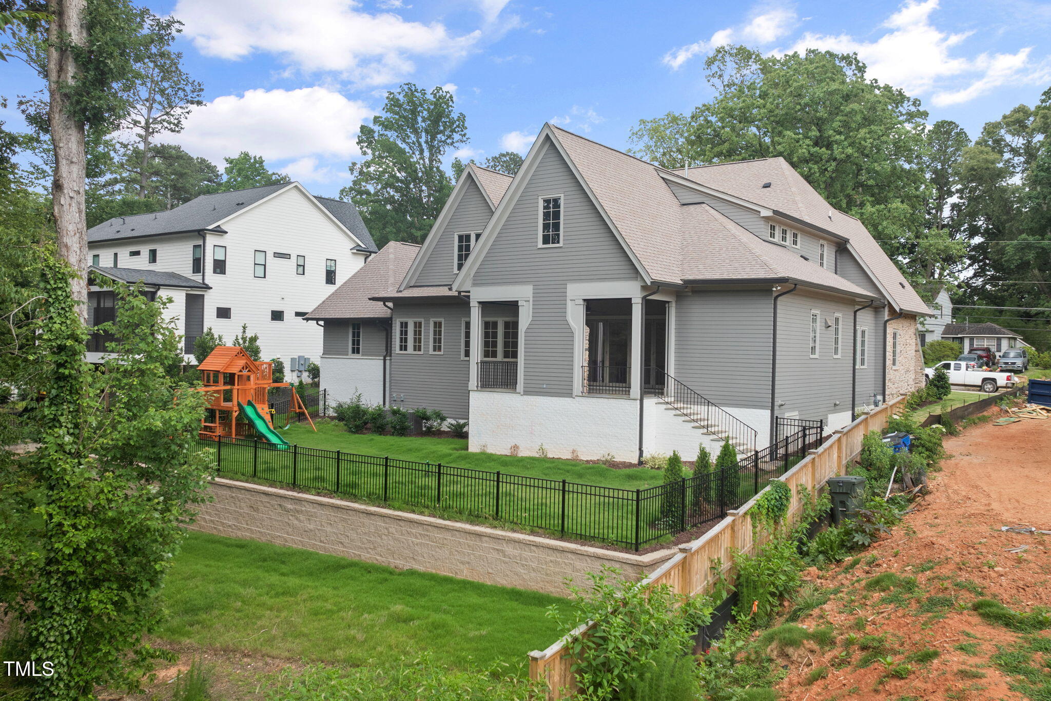 1212 Gunnison Place Raleigh, NC 27609 - Photo 50 of 53 a front view of a house with a garden and plants