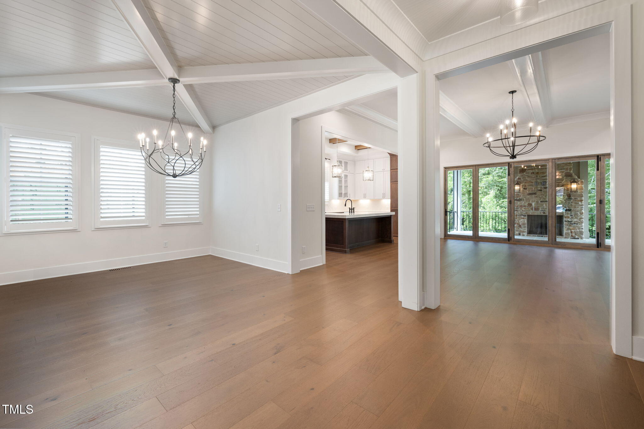1212 Gunnison Place Raleigh, NC 27609 - Photo 8 of 53 an empty room with wooden floor and windows