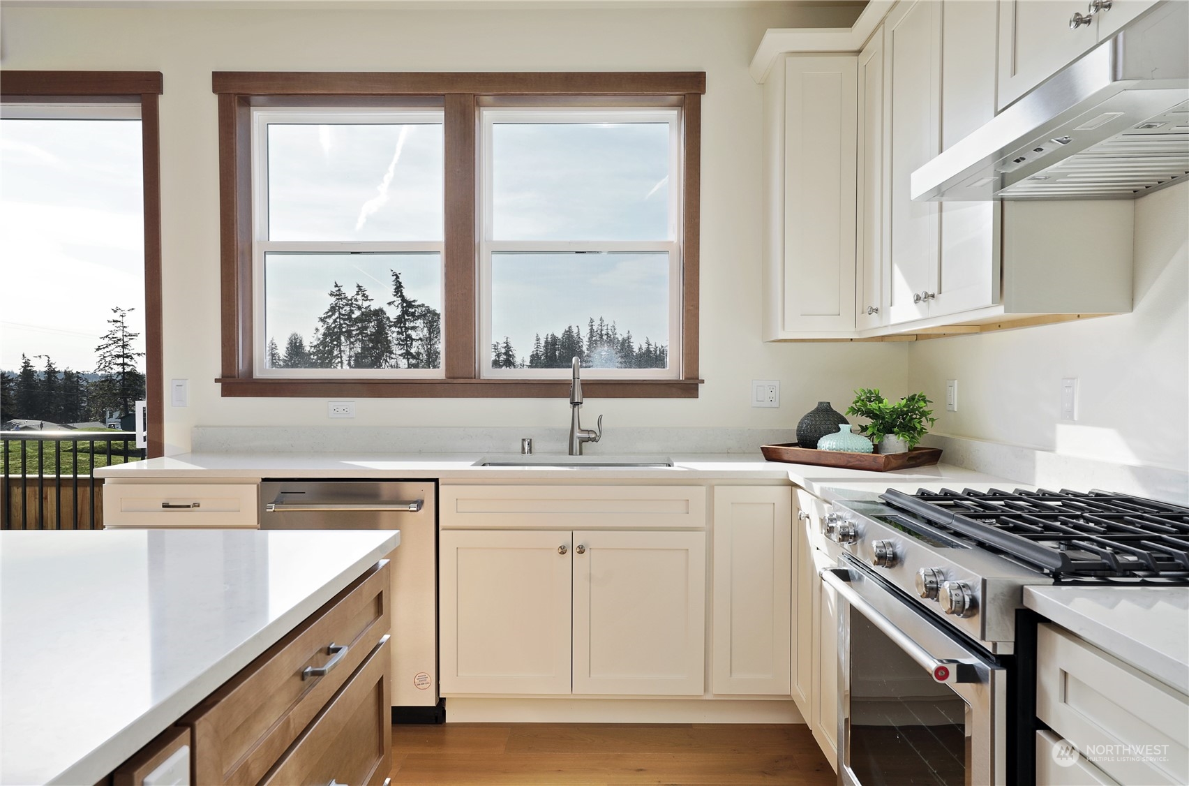 5009 Eagle Ridge Drive Freeland, WA 98249 - Photo 12 of 40 a kitchen with a sink stove top oven and cabinets