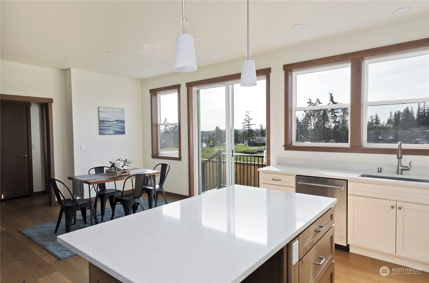 5009 Eagle Ridge Drive Freeland, WA 98249 - Photo 13 of 40 a large kitchen with kitchen island a large window in it
