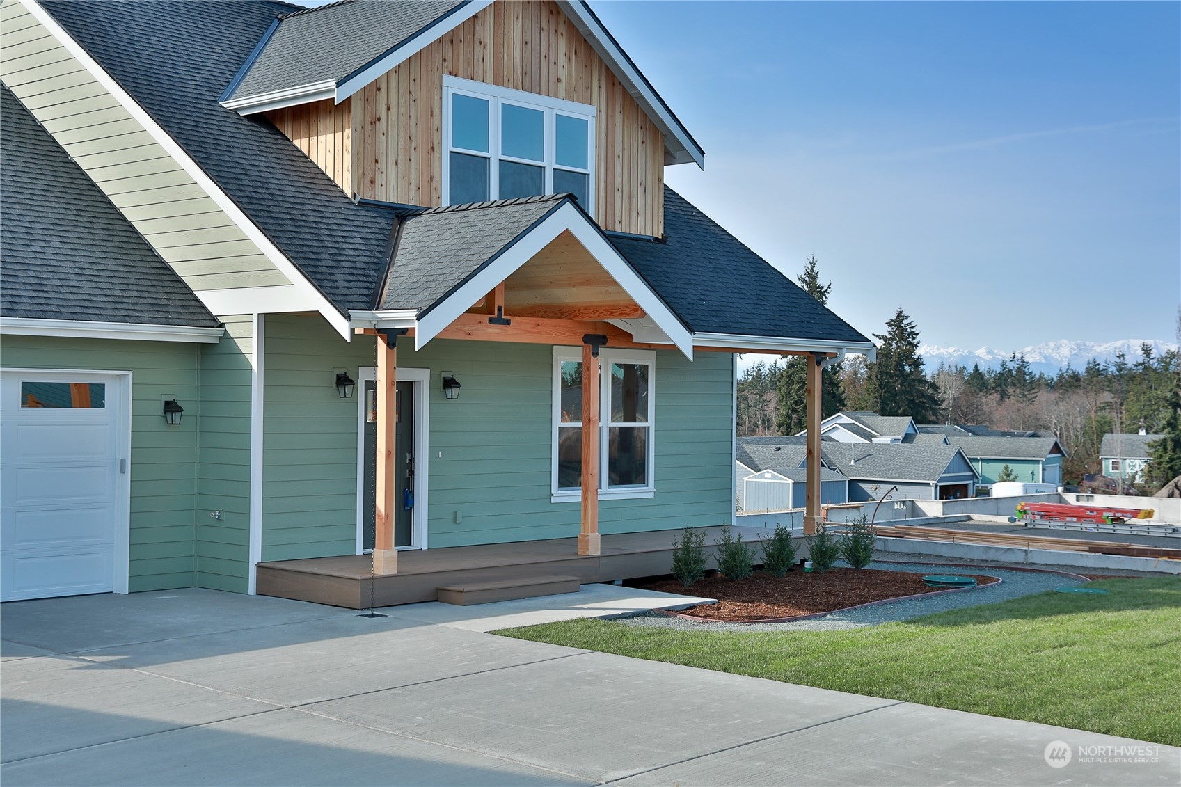 5009 Eagle Ridge Drive Freeland, WA 98249 - Photo 2 of 40 a front view of a house with garden