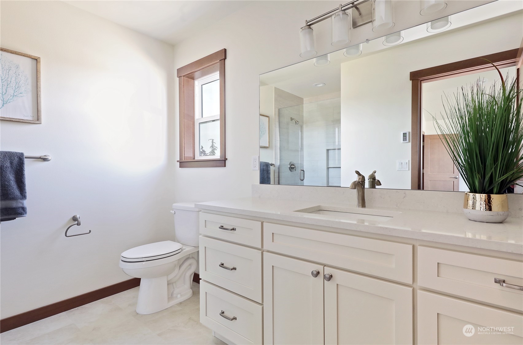 5009 Eagle Ridge Drive Freeland, WA 98249 - Photo 25 of 40 a bathroom with a granite countertop sink mirror vanity and toilet