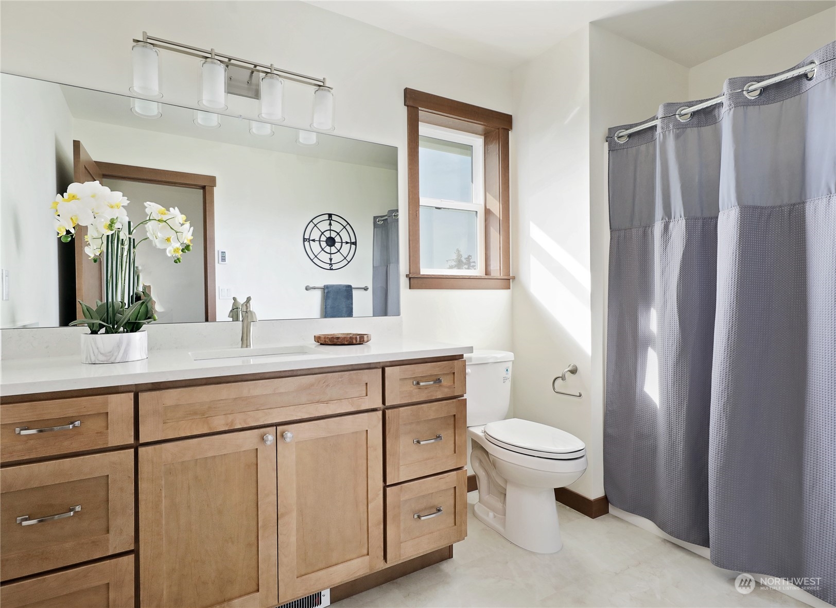 5009 Eagle Ridge Drive Freeland, WA 98249 - Photo 31 of 40 a bathroom with a toilet a sink and a large mirror