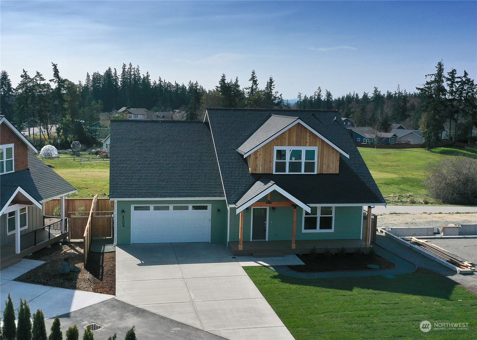 5009 Eagle Ridge Drive Freeland, WA 98249 - Photo 35 of 40 a aerial view of a house next to a yard