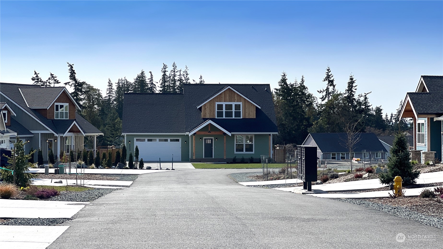 5009 Eagle Ridge Drive Freeland, WA 98249 - Photo 36 of 40 a front view of a house with a yard