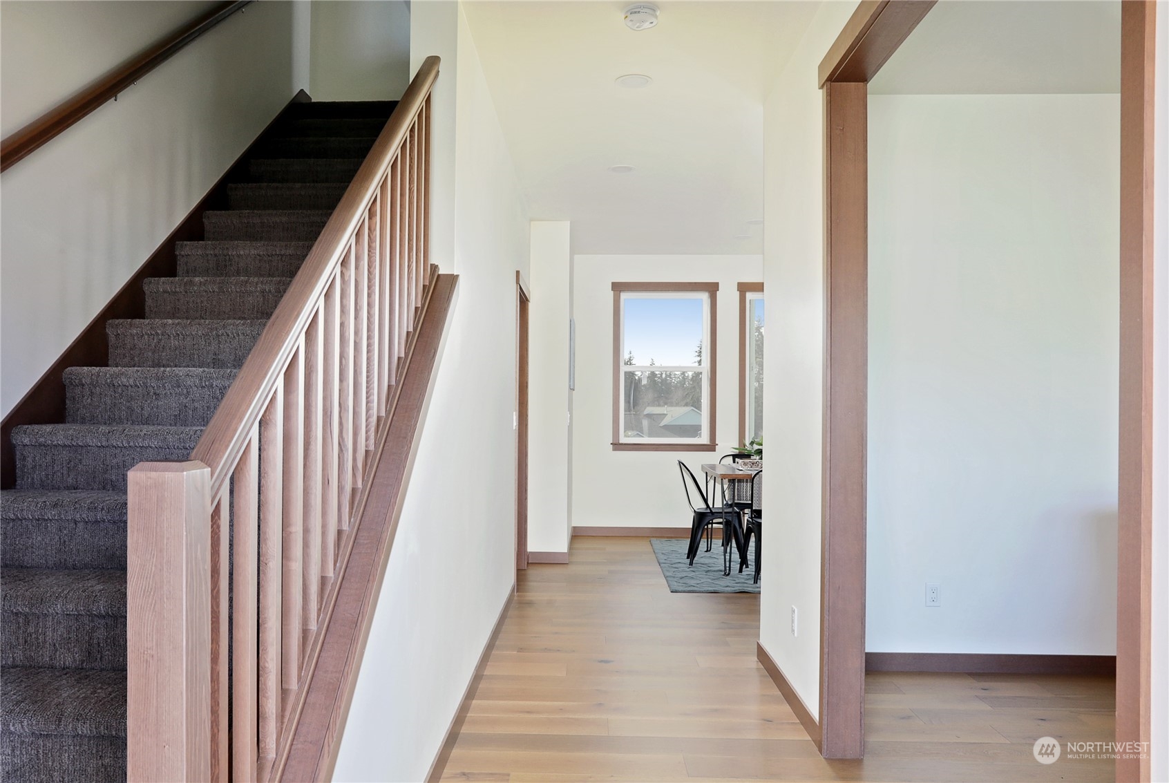 5009 Eagle Ridge Drive Freeland, WA 98249 - Photo 4 of 40 a view of a hallway with wooden floor and stairs