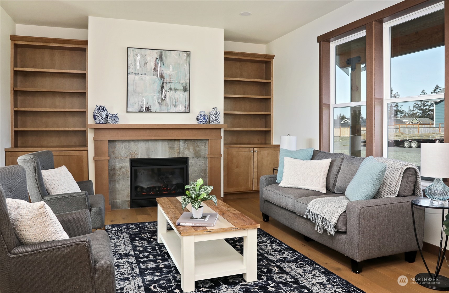 5009 Eagle Ridge Drive Freeland, WA 98249 - Photo 6 of 40 a living room with furniture and a fireplace