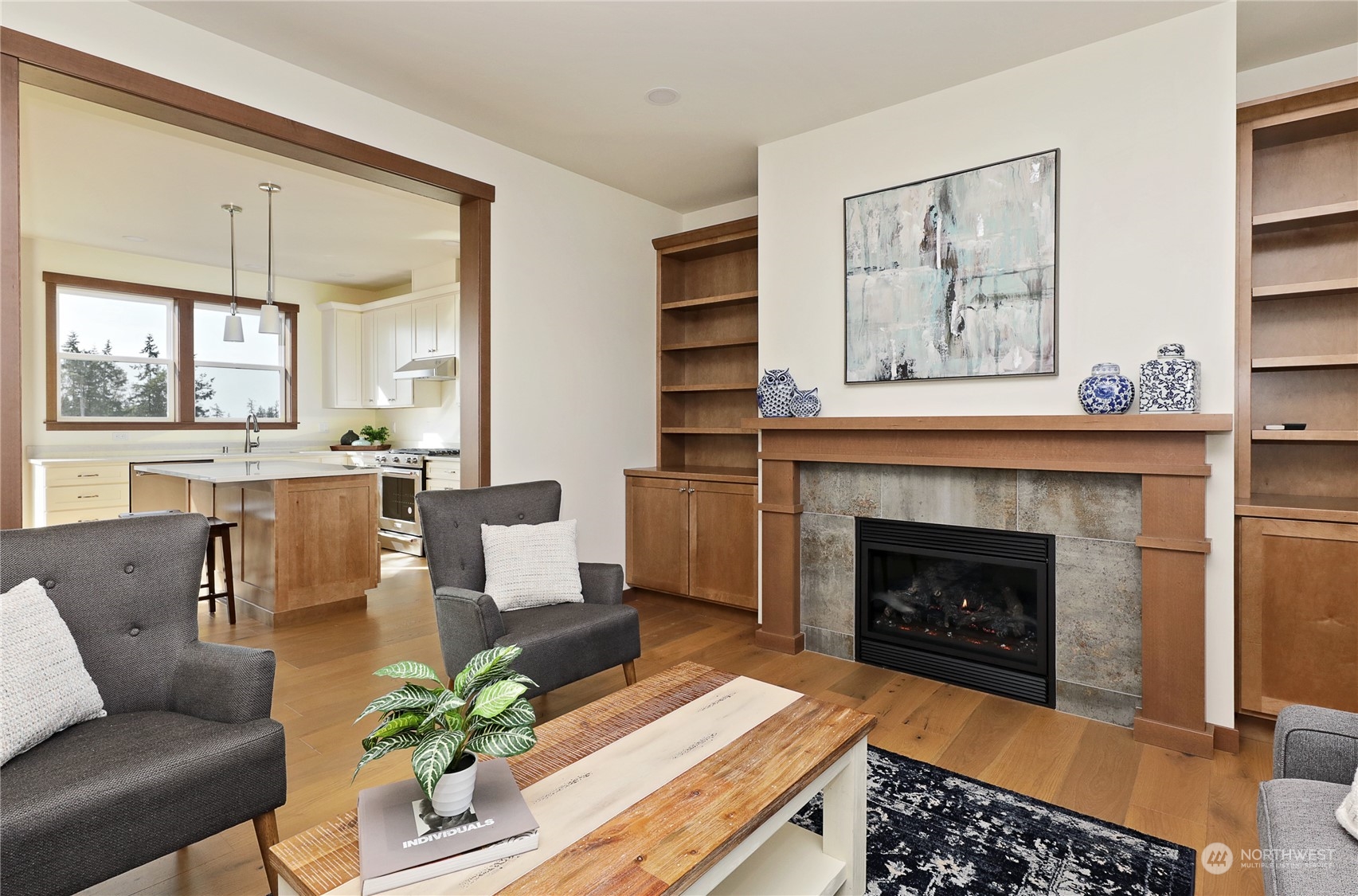 5009 Eagle Ridge Drive Freeland, WA 98249 - Photo 8 of 40 a living room with furniture and a fireplace