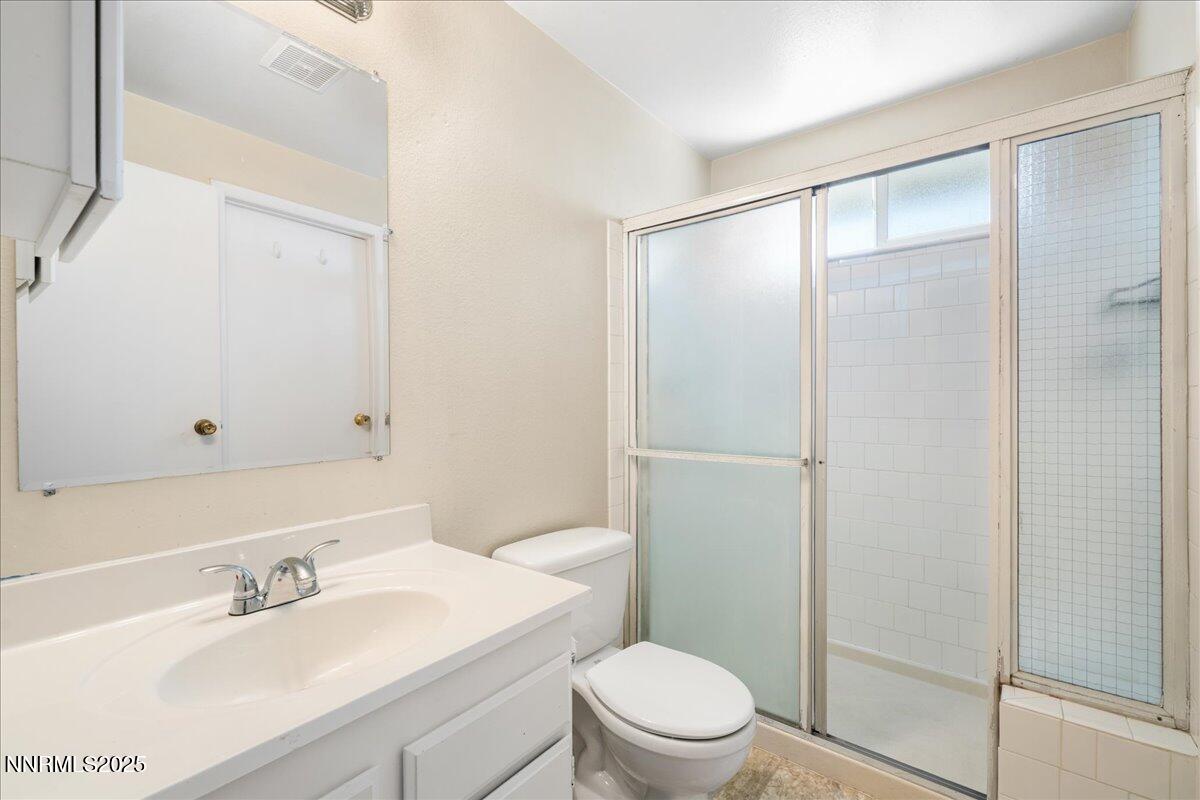 1990 Prior Road Reno, NV 89503 - Photo 19 of 35 a bathroom with a sink a toilet and shower