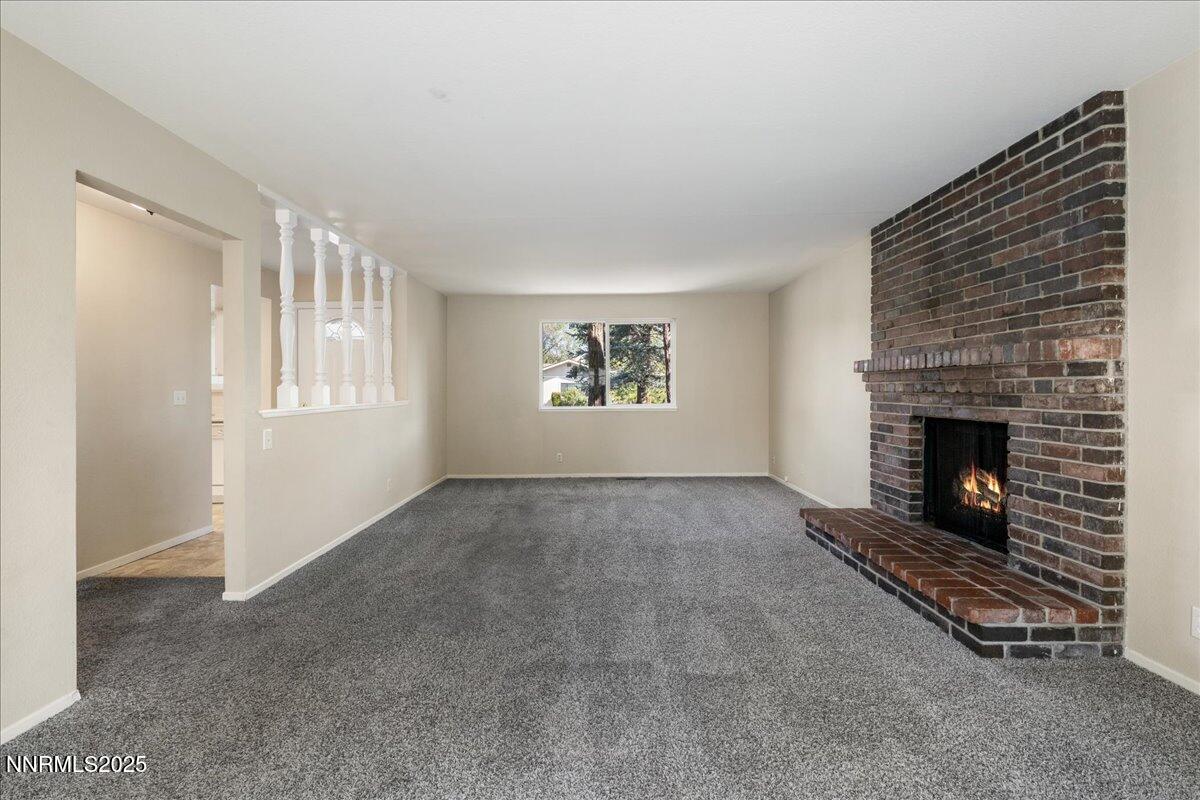 1990 Prior Road Reno, NV 89503 - Photo 5 of 35 a view of an empty room with a fireplace and a window