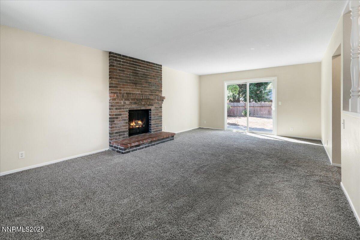 1990 Prior Road Reno, NV 89503 - Photo 6 of 35 a view of a livingroom with an empty space and a fireplace