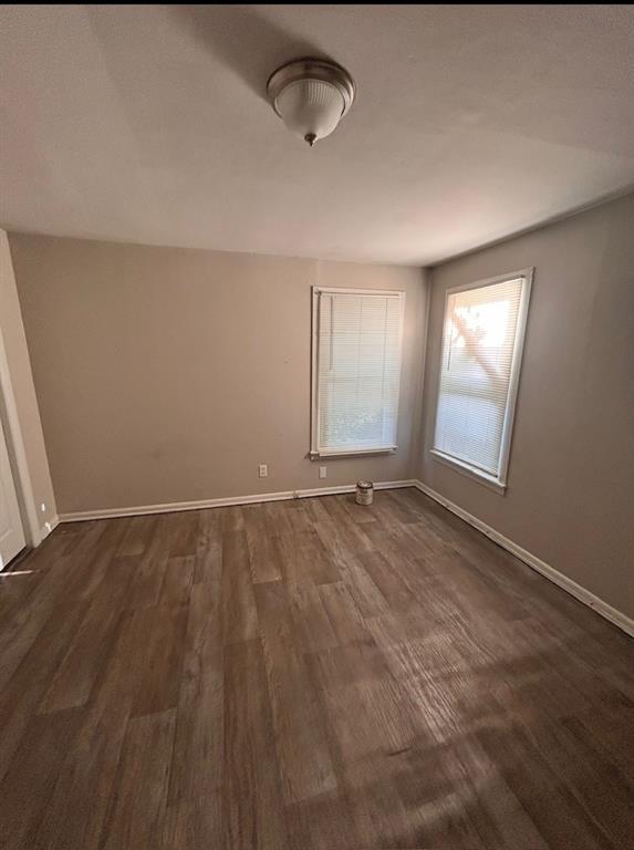 3149 Fulton Street Shreveport, LA 71109 - Photo 3 of 7 Unfurnished room with baseboards and dark wood-type flooring