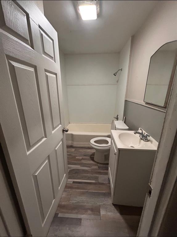 3149 Fulton Street Shreveport, LA 71109 - Photo 6 of 7 Bathroom with vanity, wood finished floors, and bathtub / shower combination