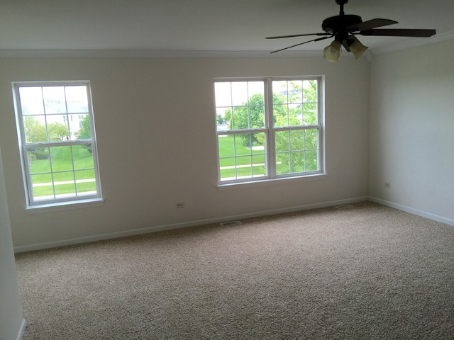 326 Prairie Ridge Drive Minooka, IL 60447 - Photo 10 of 16 an empty room with windows
