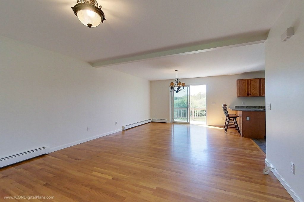 942 Saugatucket Road South Kingstown, RI 02879 - Photo 5 of 39 To the left of the front door you find this living room / dining area leading to a deck and the kitchen beyond.