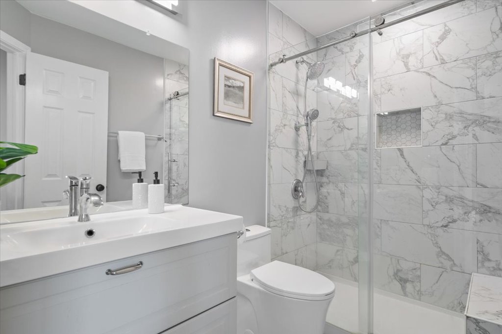 10801 Beachmont Lane Austin, TX 78739 - Photo 28 of 40 Gorgeous updated bathroom upstairs with convenient drawers and walk-in shower