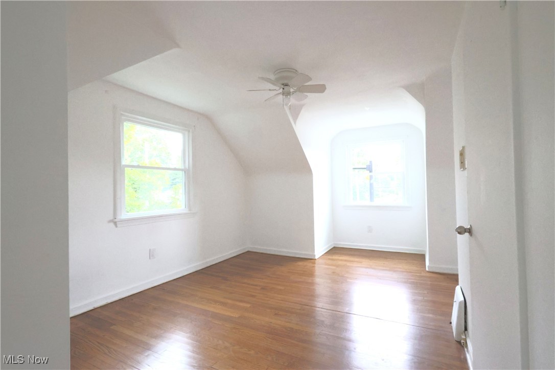 1332 South Green Road South Euclid, OH 44121 - Photo 12 of 23 Bonus room featuring plenty of natural light, lofted ceiling, wood finished floors, a ceiling fan, and a baseboard heating unit