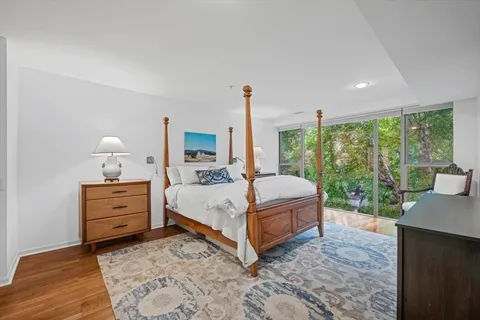 a bed room with a bed and a window