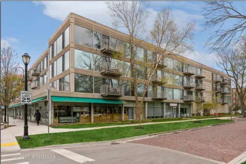 a view of a building with a yard