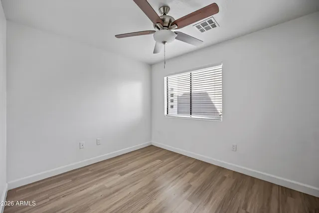 a bathroom with a bath tub sink mirror and a shower
