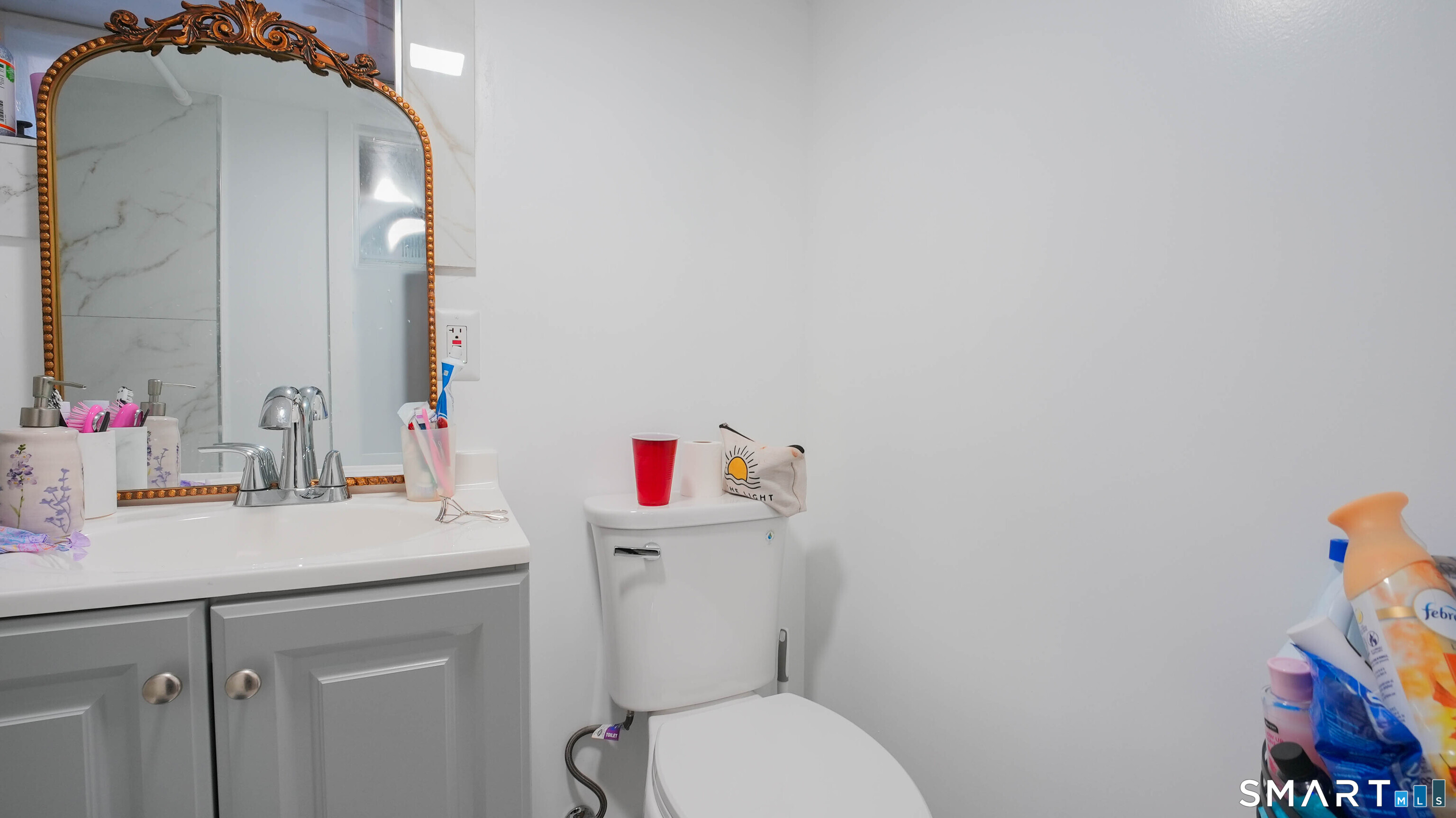 849 Frost Road Waterbury, CT 06705 - Photo 34 of 36 a bathroom with a sink vanity mirror and toilet