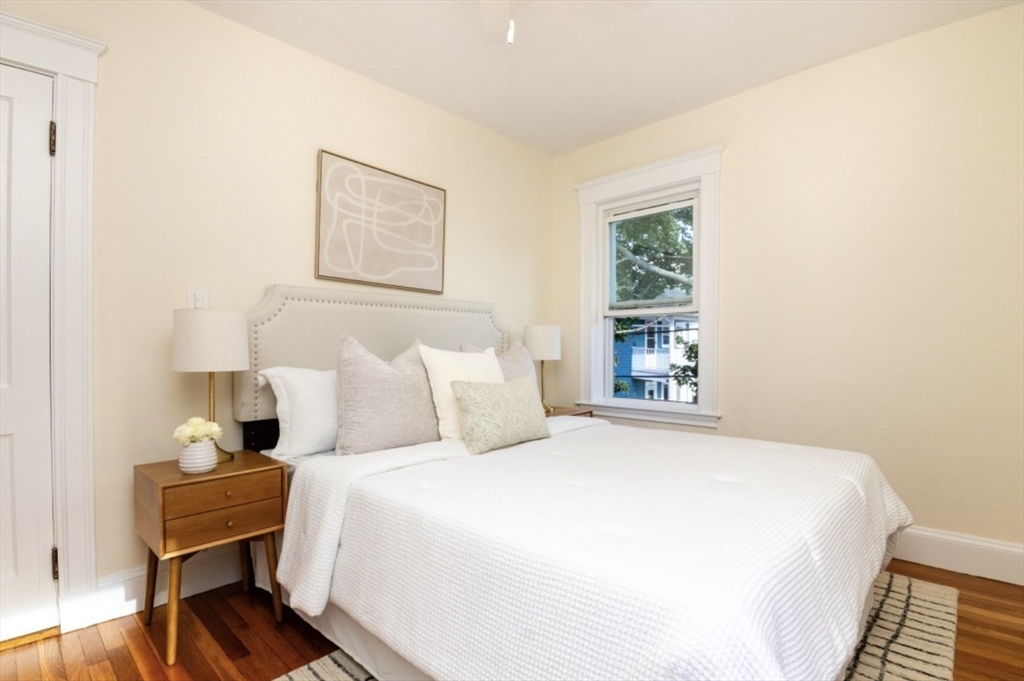 33 Pierce Avenue, Unit 2 Boston, MA 02122 - Photo 13 of 16 a bedroom with a bed and a window