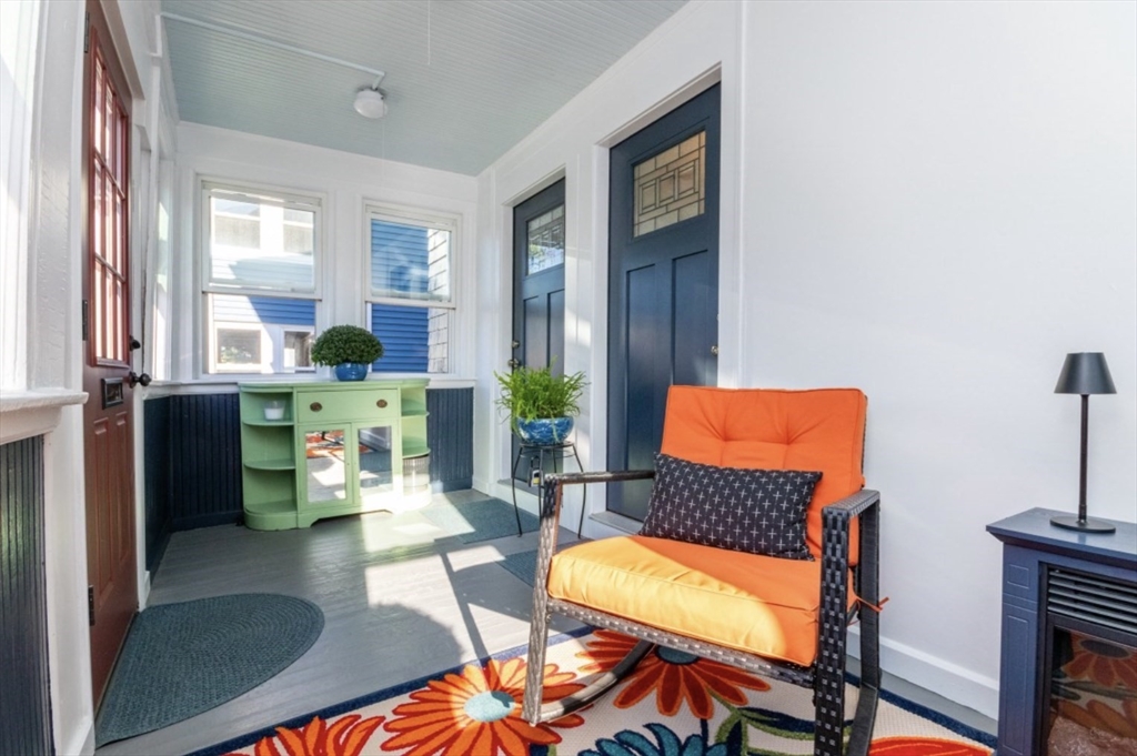 33 Pierce Avenue, Unit 2 Boston, MA 02122 - Photo 2 of 16 a living room with furniture a lamp and large window
