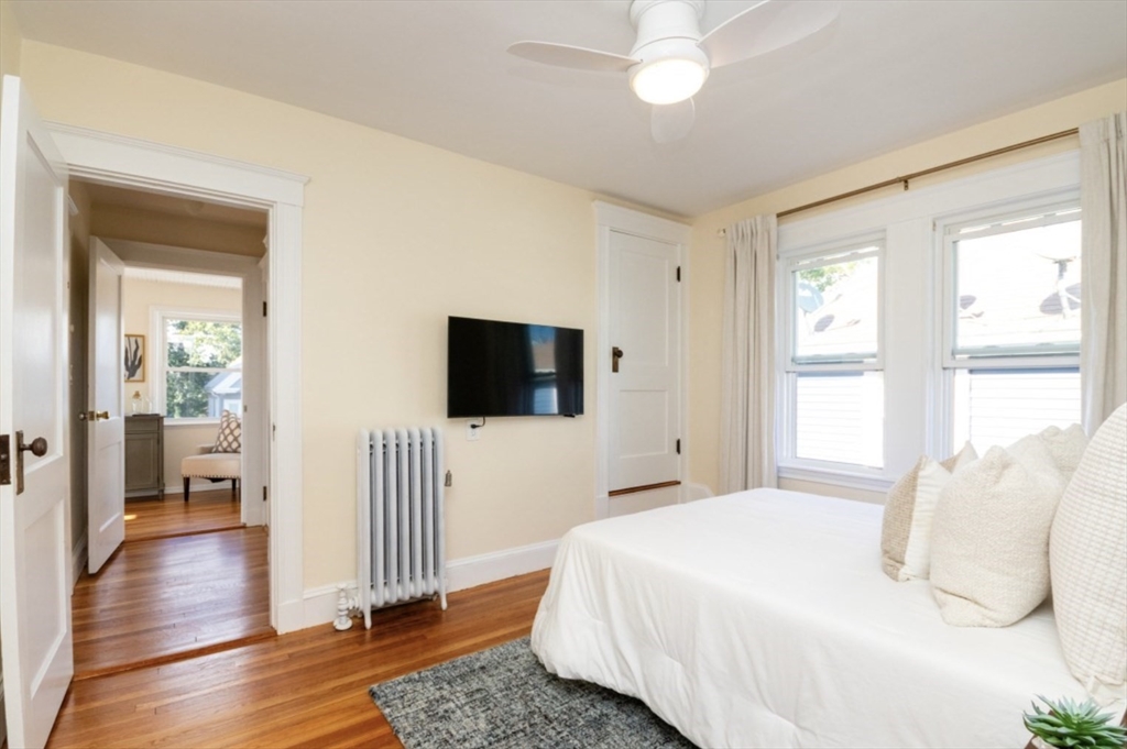 33 Pierce Avenue, Unit 2 Boston, MA 02122 - Photo 10 of 16 a bedroom with a bed and a flat screen tv