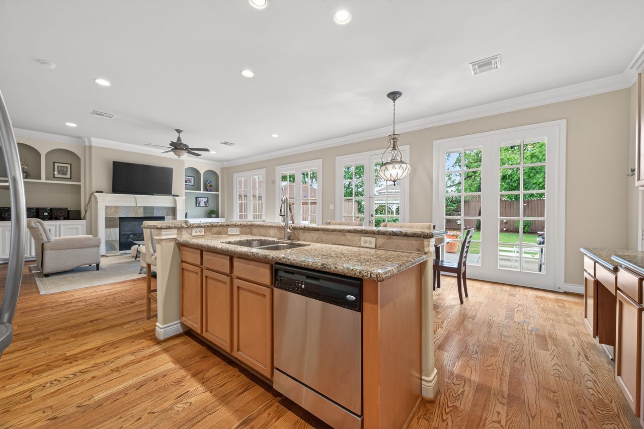 10932 Lasso Lane Houston, TX 77079 - Photo 12 of 38 a kitchen with counter top space and wooden floor