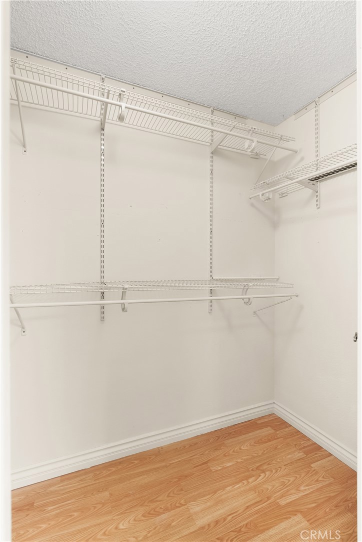 12621 Moordale Circle, Unit G Stanton, CA 90680 - Photo 25 of 36 a view of a room with racks on the wall