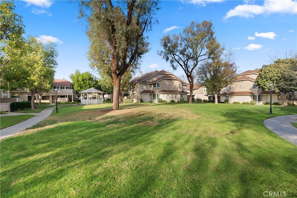 12621 Moordale Circle, Unit G Stanton, CA 90680 - Photo 28 of 36 a view of a yard with plants and trees