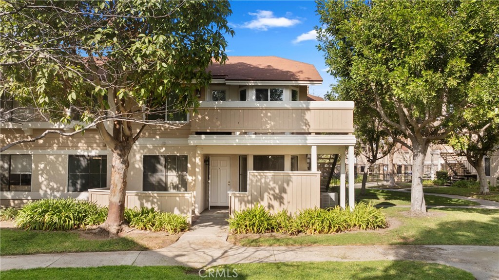 12621 Moordale Circle, Unit G Stanton, CA 90680 - Photo 30 of 36 front view of a house with a yard