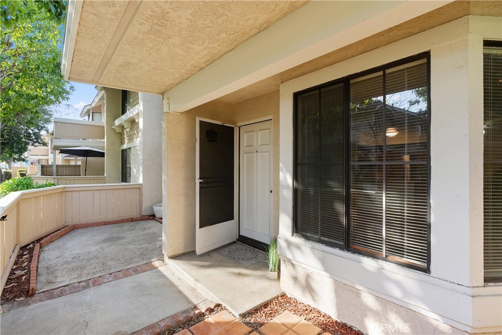 12621 Moordale Circle, Unit G Stanton, CA 90680 - Photo 3 of 36 a view of a entryway door front of house