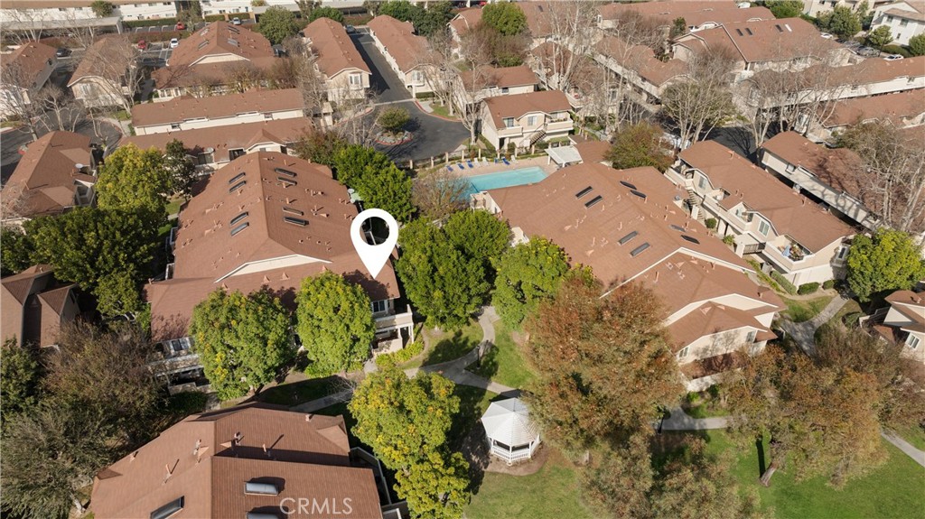 12621 Moordale Circle, Unit G Stanton, CA 90680 - Photo 33 of 36 an aerial view of a house with a yard and garden