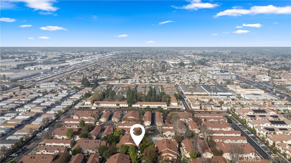 12621 Moordale Circle, Unit G Stanton, CA 90680 - Photo 34 of 36 an aerial view of residential building with parking space