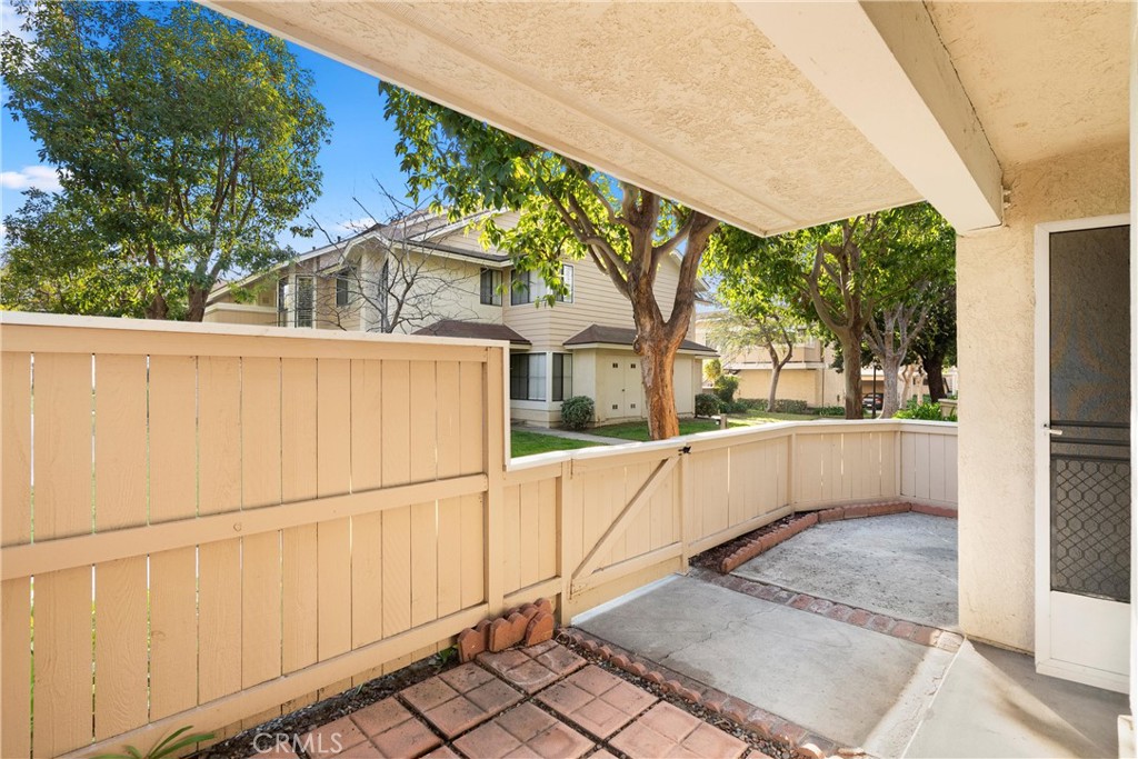 12621 Moordale Circle, Unit G Stanton, CA 90680 - Photo 4 of 36 a view of a white house with a large window and tree