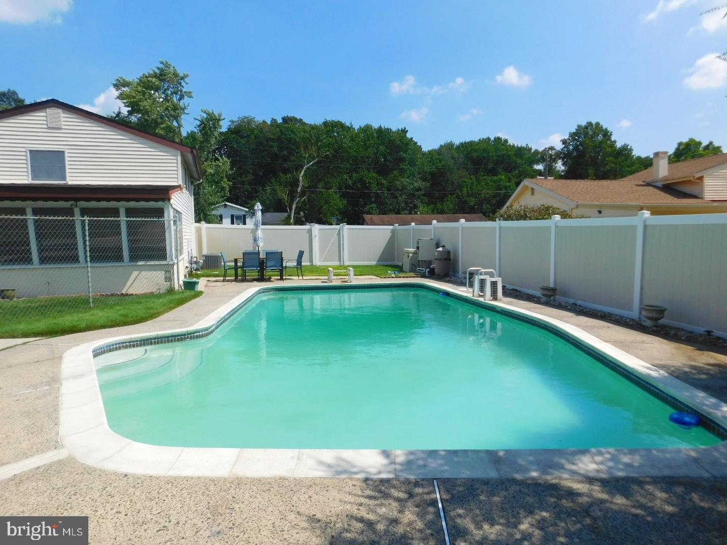228 Somerset Road Deptford, NJ 08096 - Photo 4 of 17 a view of a backyard with swimming pool