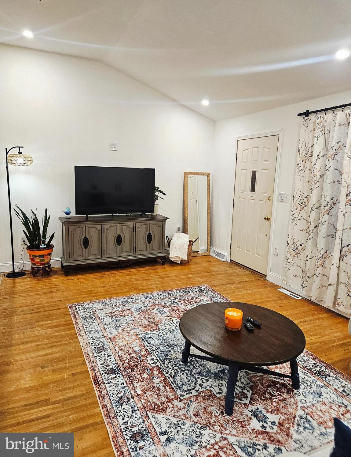 228 Somerset Road Deptford, NJ 08096 - Photo 6 of 17 a room with furniture and flat screen tv