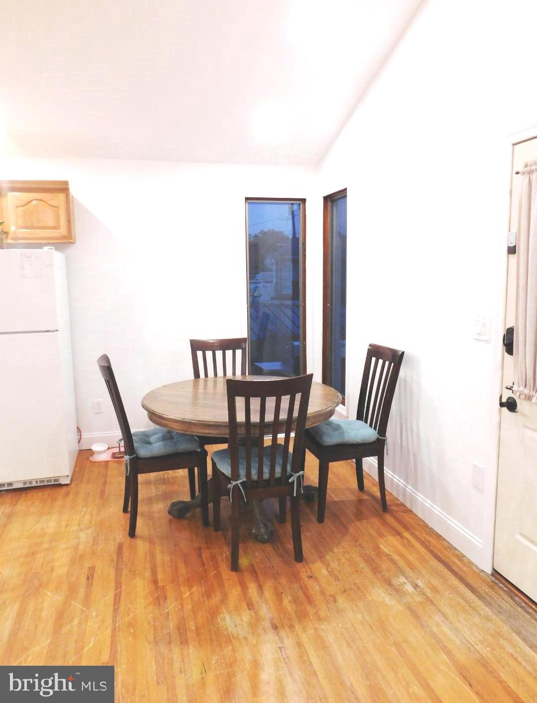 228 Somerset Road Deptford, NJ 08096 - Photo 8 of 17 a view of a dining room with furniture and wooden floor