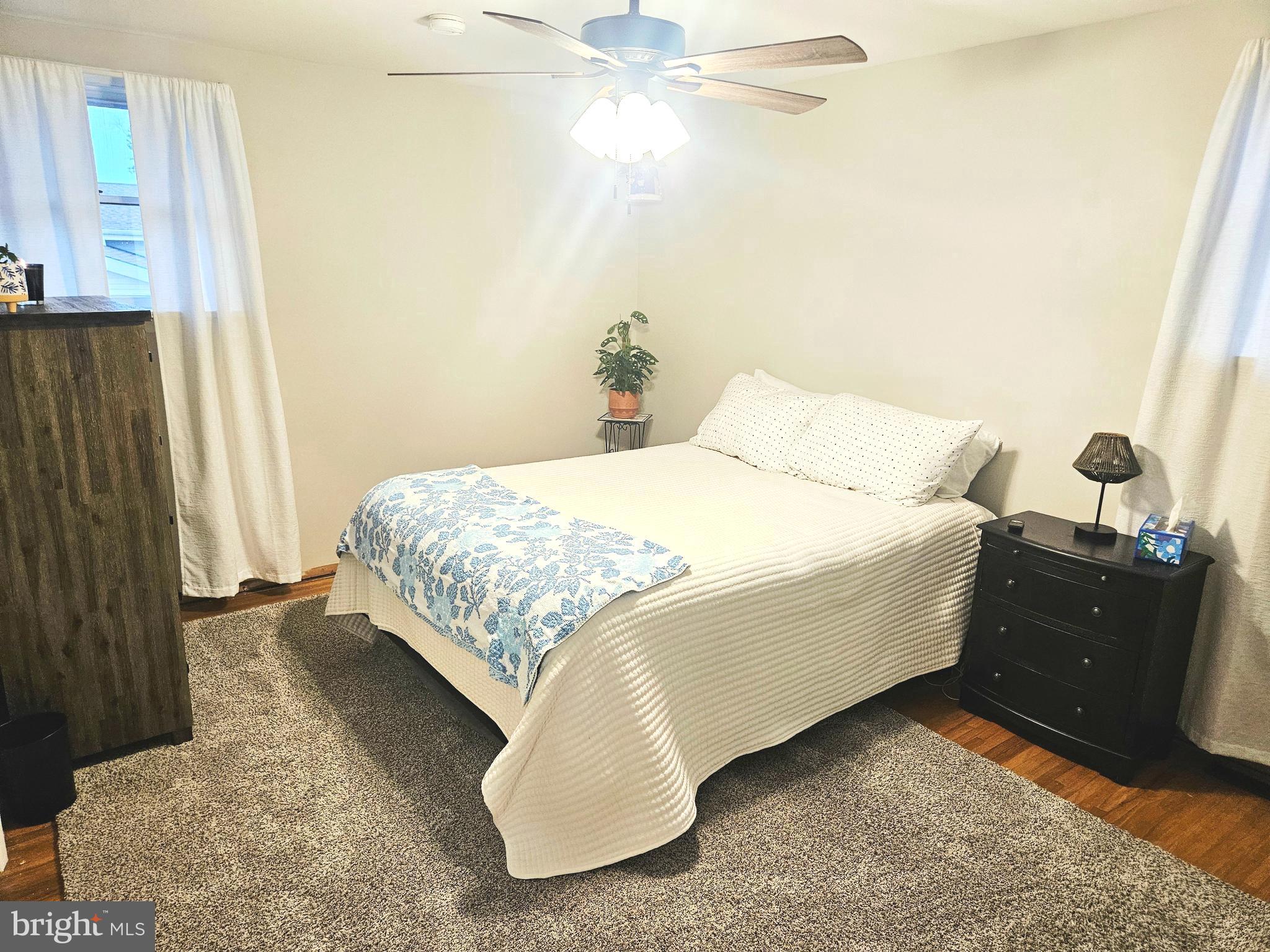 228 Somerset Road Deptford, NJ 08096 - Photo 9 of 17 a bedroom with a bed and a cabinets