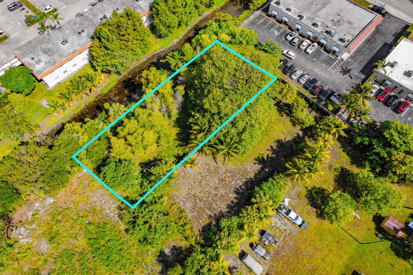 6214 Edwards Road Pompano Beach, FL 33063 - Photo 11 of 41 a aerial view of a backyard