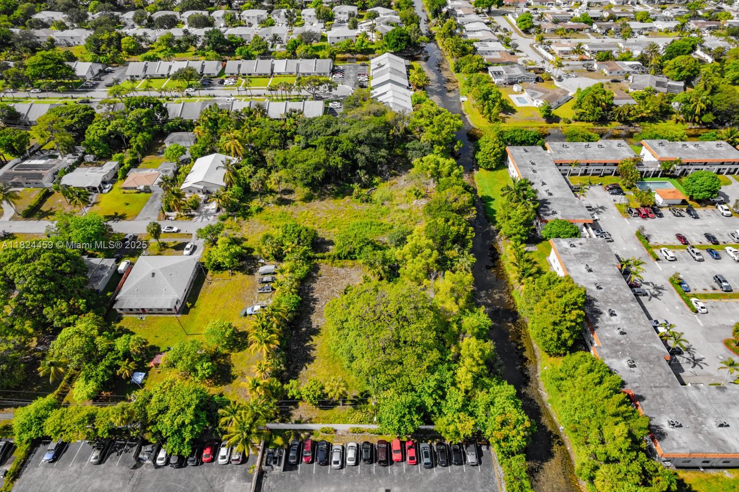6214 Edwards Road Pompano Beach, FL 33063 - Photo 16 of 41 an aerial view of a houses with yard