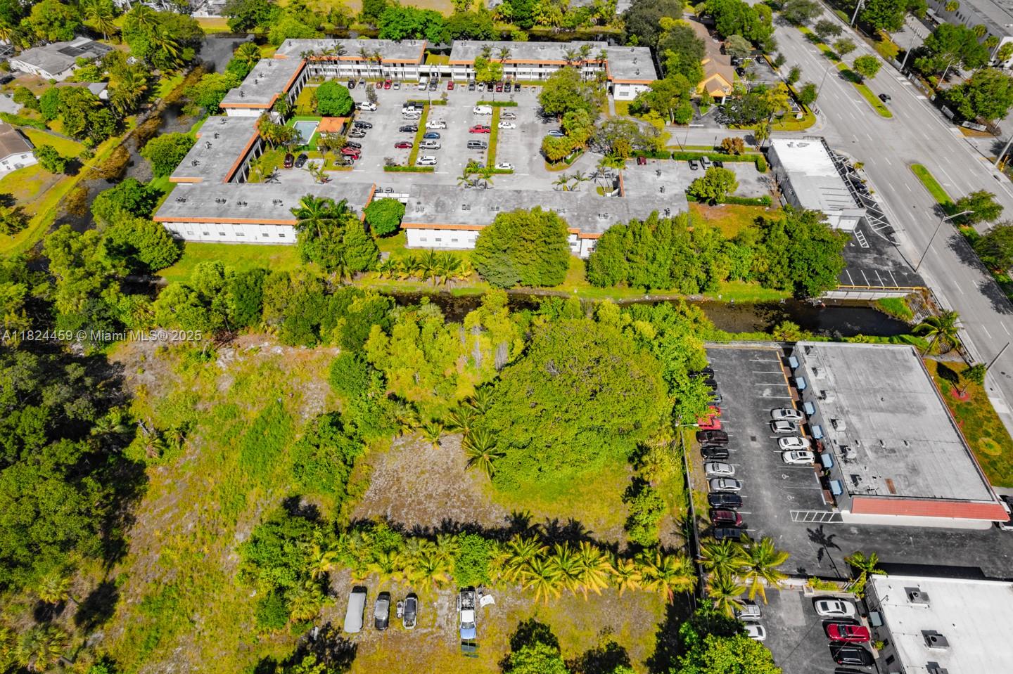 6214 Edwards Road Pompano Beach, FL 33063 - Photo 18 of 41 an aerial view of residential houses with outdoor space