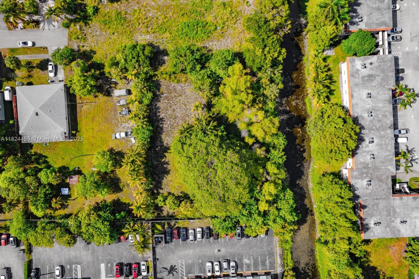 6214 Edwards Road Pompano Beach, FL 33063 - Photo 22 of 41 an aerial view of residential house with swimming pool and lawn chairs