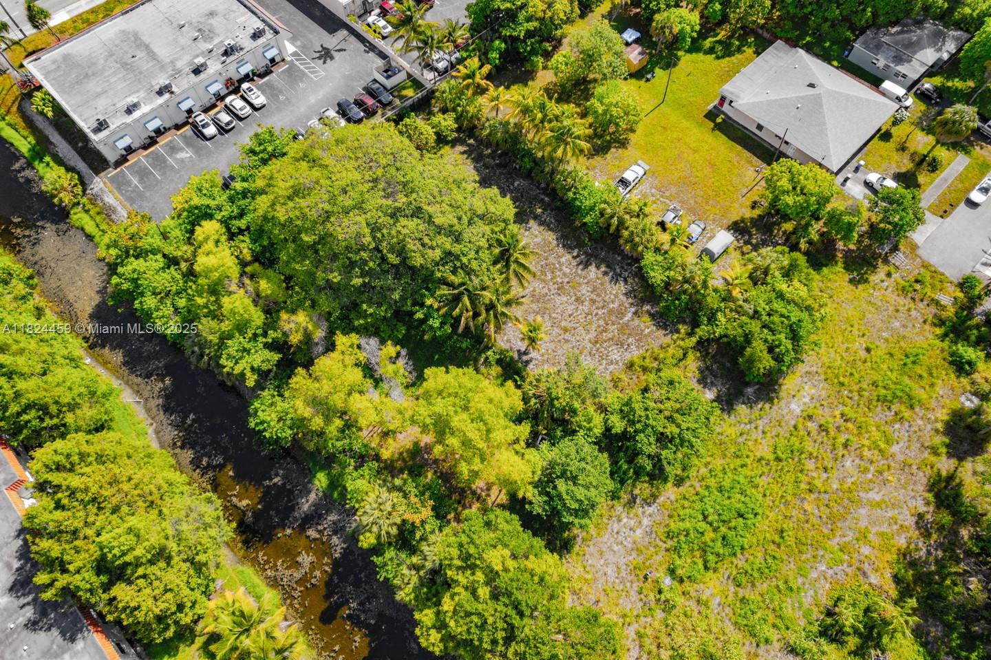 6214 Edwards Road Pompano Beach, FL 33063 - Photo 25 of 41 an aerial view of a house with a yard and garden space