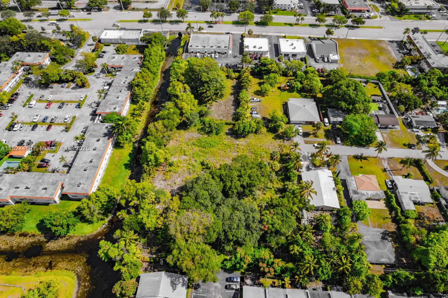 6214 Edwards Road Pompano Beach, FL 33063 - Photo 29 of 41 a aerial view of residential houses with outdoor space and swimming pool