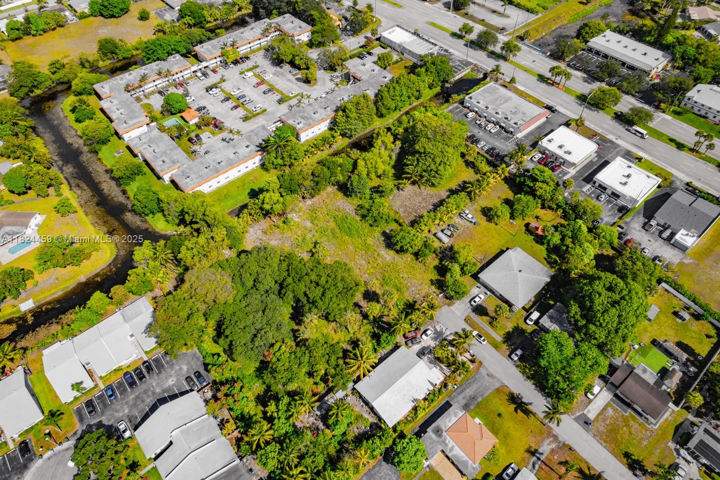 6214 Edwards Road Pompano Beach, FL 33063 - Photo 31 of 41 an aerial view of a residential houses with yard